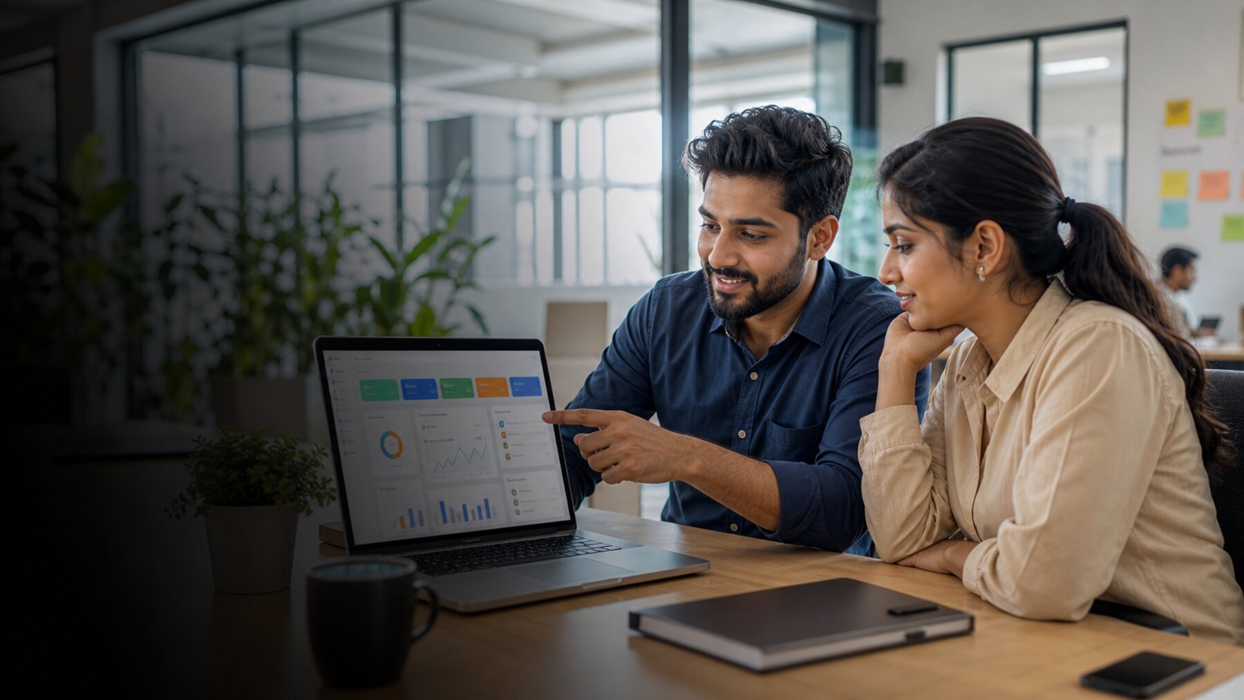 Middle-class Indian entrepreneur checking the daily business dashboard on a laptop